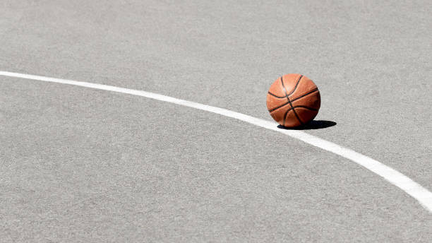 istock Basketball ball on asphalt 1152856873