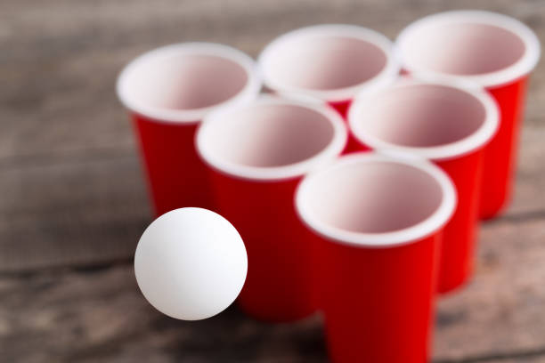 istock Game Beer Pong on wooden table 1152858709