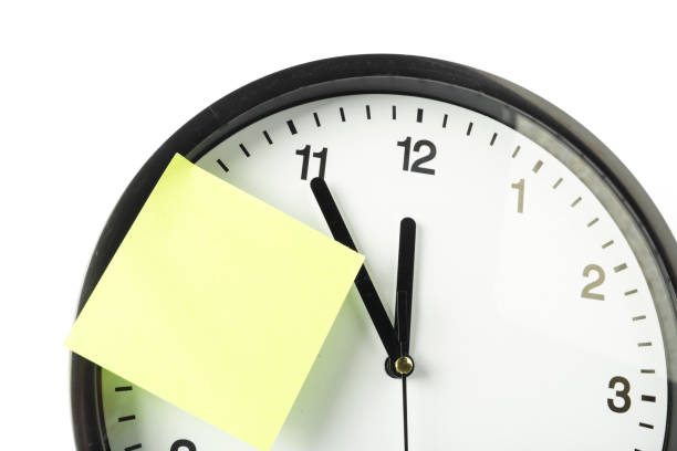 istock paper stick on clock for notice something with white background 1152859363