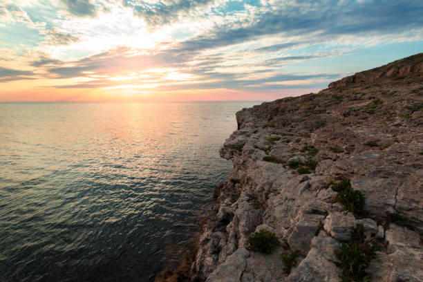 istock Brilliant vacation destination beach sunrise and sea cliffs background 1152859761