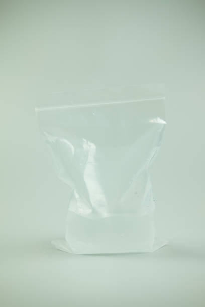 istock Ice cubes in plastic bag on gray background 1152859873