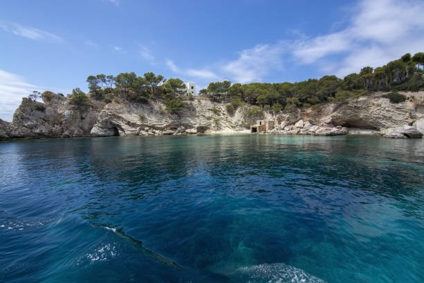 Pretty Buildings Cala Fornells Sea Majorca SANTA PONSA, MALLORCA, SPAIN - MAY 29, 2019: Pretty buildings in Cala Fornells from sea on May 29, 2019 in Santa Ponsa, Mallorca, Spain. seaside views of cala fornells mallorca stock pictures, royalty-free photos & images