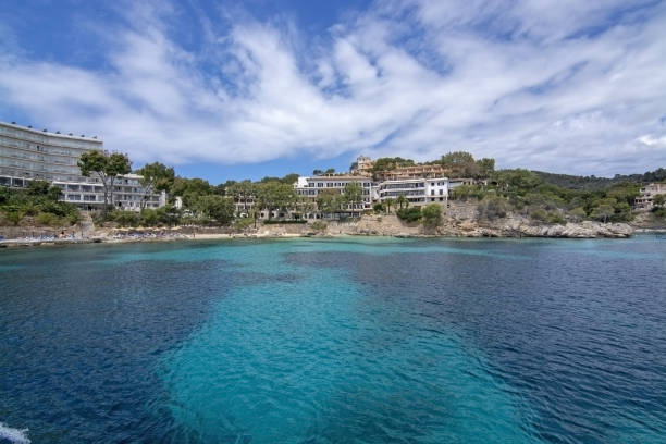 Hotel Cala Fornells Sea Majorca SANTA PONSA, MALLORCA, SPAIN - MAY 29, 2019: Hotel Cala Fornells from sea on May 29, 2019 in Santa Ponsa, Mallorca, Spain. seaside views of cala fornells mallorca stock pictures, royalty-free photos & images