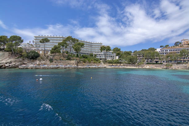 Hotel Cala Fornells Sea Majorca SANTA PONSA, MALLORCA, SPAIN - MAY 29, 2019: Hotel Cala Fornells from sea on May 29, 2019 in Santa Ponsa, Mallorca, Spain. seaside views of cala fornells mallorca stock pictures, royalty-free photos & images