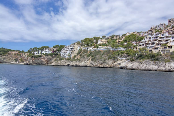 Pretty Buildings Cala Fornells Sea Majorca SANTA PONSA, MALLORCA, SPAIN - MAY 29, 2019: Pretty buildings in Cala Fornells from sea on May 29, 2019 in Santa Ponsa, Mallorca, Spain. seaside views of cala fornells mallorca stock pictures, royalty-free photos & images