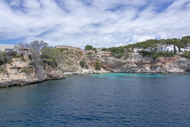 Pretty Buildings Cala Fornells Sea Majorca SANTA PONSA, MALLORCA, SPAIN - MAY 29, 2019: Pretty buildings in Cala Fornells from sea on May 29, 2019 in Santa Ponsa, Mallorca, Spain. seaside views of cala fornells mallorca stock pictures, royalty-free photos & images
