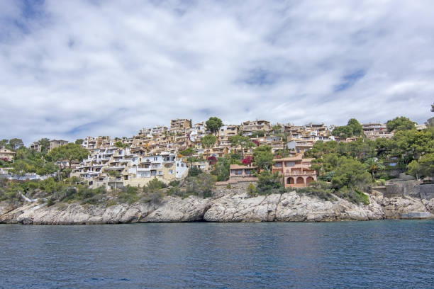 Pretty Buildings Cala Fornells Sea Majorca SANTA PONSA, MALLORCA, SPAIN - MAY 29, 2019: Pretty buildings in Cala Fornells from sea on May 29, 2019 in Santa Ponsa, Mallorca, Spain. seaside views of cala fornells mallorca stock pictures, royalty-free photos & images