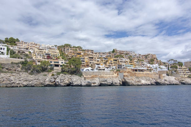 Pretty Buildings Cala Fornells Sea Majorca SANTA PONSA, MALLORCA, SPAIN - MAY 29, 2019: Pretty buildings in Cala Fornells from sea on May 29, 2019 in Santa Ponsa, Mallorca, Spain. seaside views of cala fornells mallorca stock pictures, royalty-free photos & images