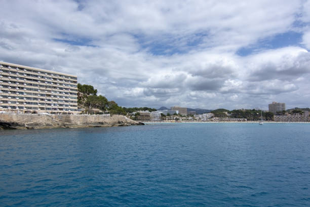 Pretty Buildings Cala Fornells Sea Majorca SANTA PONSA, MALLORCA, SPAIN - MAY 29, 2019: Hotel in Paguera from sea turquoise water on May 29, 2019 in Santa Ponsa, Mallorca, Spain. seaside views of cala fornells mallorca stock pictures, royalty-free photos & images