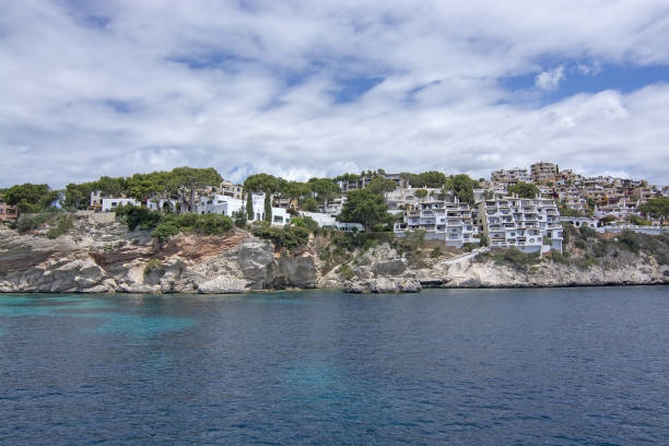 Pretty Buildings Cala Fornells Sea Majorca SANTA PONSA, MALLORCA, SPAIN - MAY 29, 2019: Pretty buildings in Cala Fornells from sea on May 29, 2019 in Santa Ponsa, Mallorca, Spain. seaside views of cala fornells mallorca stock pictures, royalty-free photos & images