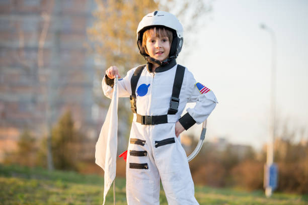 istock Adorable little boy, dressed as astronaut, playing in park 1152860947
