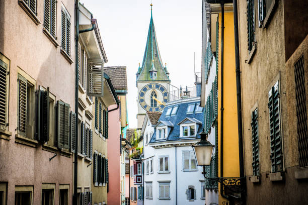 St. Peter Church Seen From Alley In Zurich, Switzerland St. Peter Church Seen From Alley In Zurich, Switzerland switzerland zurich architecture church stock pictures, royalty-free photos & images