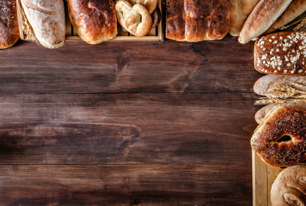 Artisanal bakery:  Fresh mixed Bun, rolls and ingredients making a frame with copy space