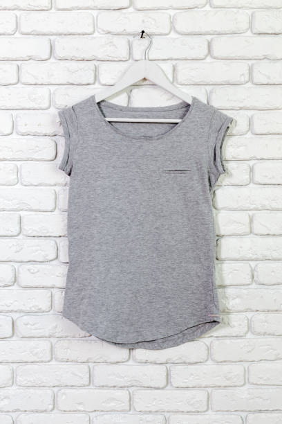 istock brick whitewashed wall with t-shirt on hanger 1152867221