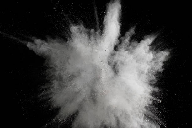 istock White powder explosion cloud against black background.White dust particles splash. 1152867407