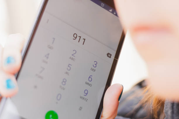 Closeup shot of phone display with the number 911 dialed stock photo