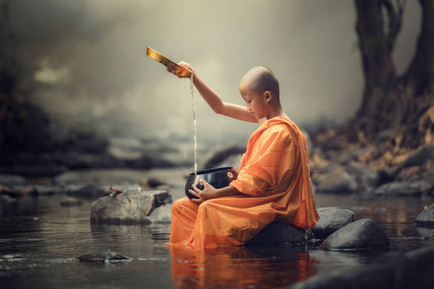 Novice Monks Novice Monks Thailand ,Buddhist Temple,Novice Monk Depicting a Religious Faith in a Temple in Thailand. cambodian culture photos stock pictures, royalty-free photos & images