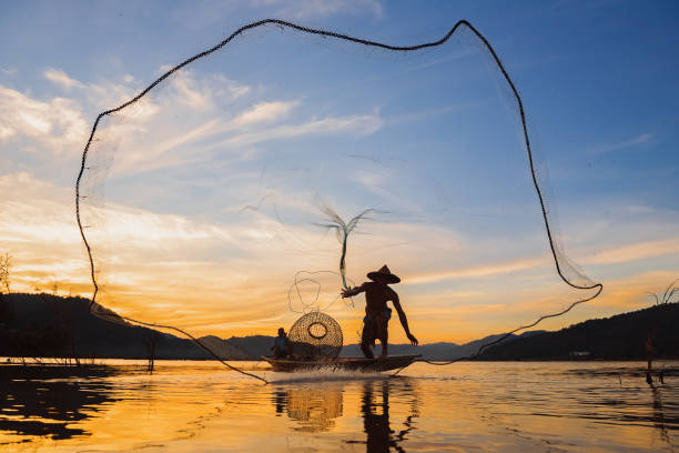 istock fisherman fishing in the river 1152869940