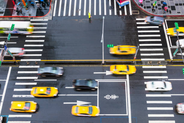 istock Busy traffic crossing an intersection in the rain 1152870085