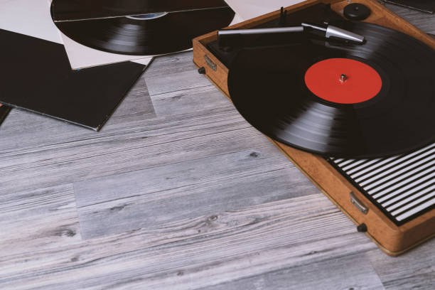 istock Older turntable vinyl record player on gray wooden 1152871532