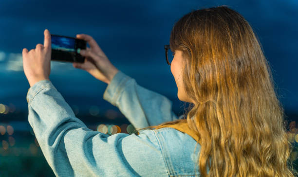 istock Woman taking photos with smart phone 1152872264