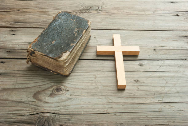 istock Holy bible and cross 1152872392