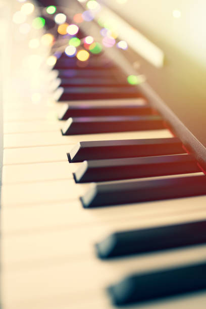 istock piano keys and playing piano 1152875484