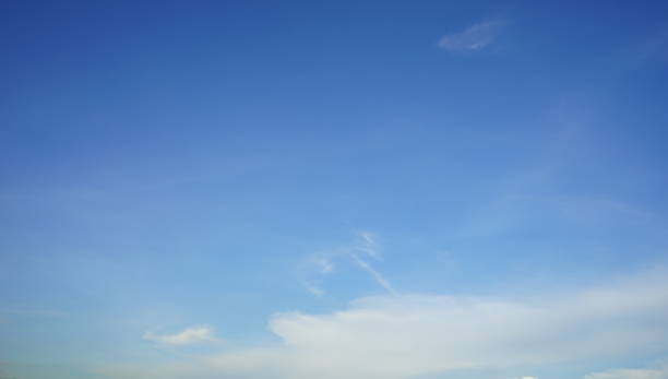 istock Clear blue sky with the fluffy clouds background 1152876967