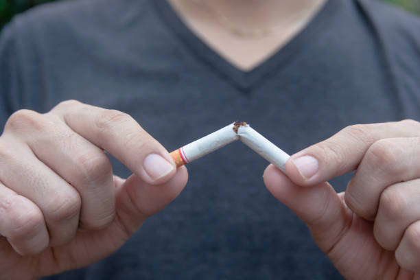 istock Stop cigarette, woman hands breaking the cigarette with clipping path 1152877740