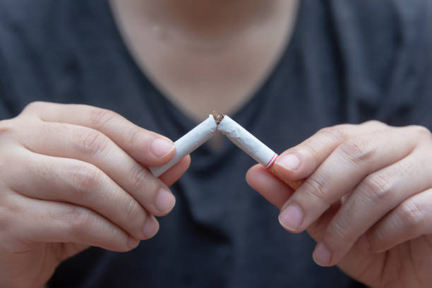 istock Stop cigarette, woman hands breaking the cigarette with clipping path 1152878129