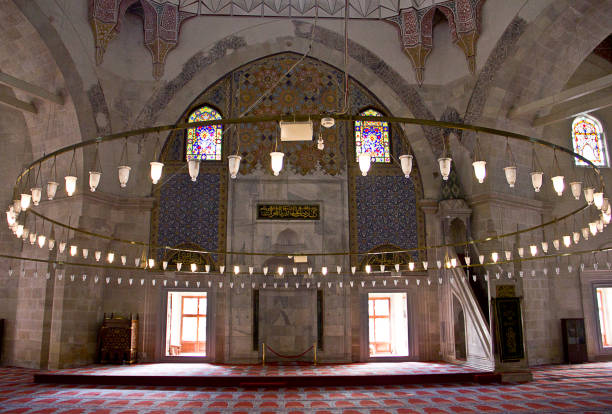 Edirne three Şerefeli Mosque, Uc Serefeli Mosque Edirne, Turkey - April 19, 2019: People pray in mosque called 3 şerefeli cami (Uc Serefeli mosque) Mosque in the center of city of Edirne, East Thrace, Turkey. The Üç Serefeli Mosque, named after its unusual minaret with three balconies (serefe), was built between 1438. unesco organised group stock pictures, royalty-free photos & images