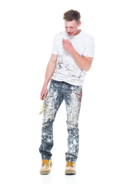istock Young attractive male painter standing on white background - crying 1152880386