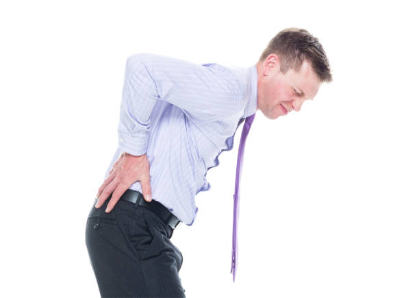 istock Attractive young caucasian man in business attire - backache 1152881193