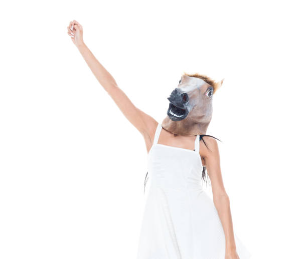 istock Cute female wearing a horse head 1152882641
