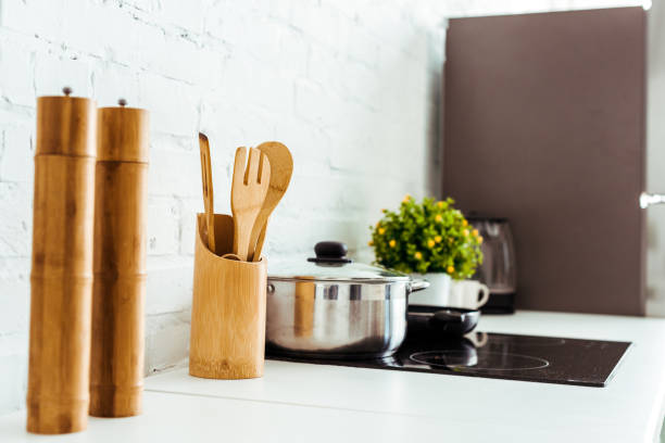 istock kitchen table with cooking utensils and electric oven 1152883284