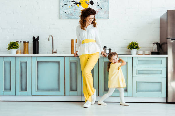 istock happy mother standing with emotional daughter in kitchen 1152883427