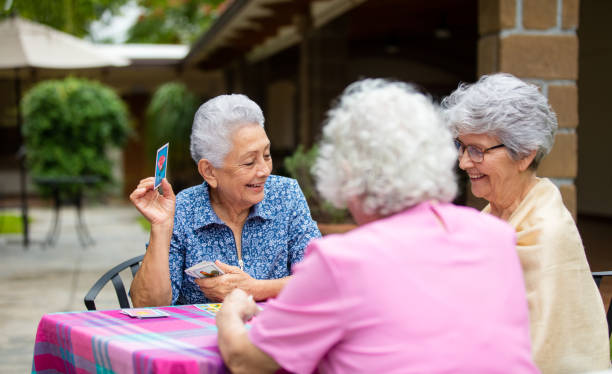 istock Elderly women playing cards outside 1152884190