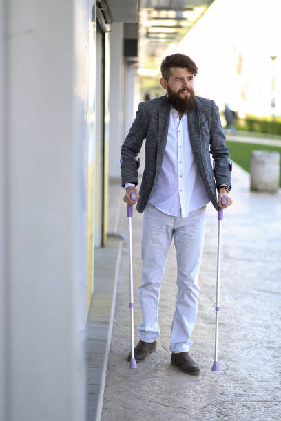 istock Young man with walking sticks outdoors 1152884549