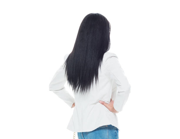 Beautiful latino female wearing a jacket and jeans - hands on hips