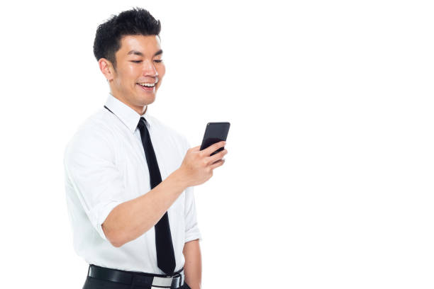 istock Handsome Asian Businessman - texting on smart phone 1152886241