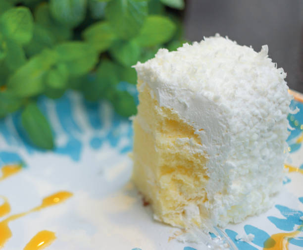 istock Small white mousse cake, blue and white plates and green mint leaves 1152887478