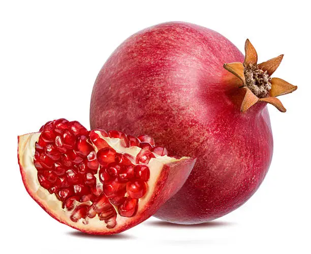 Photo of Pomegranate isolated on white background with clipping path