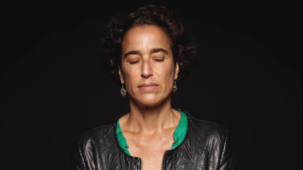 istock Woman with eyes closed 1152895193