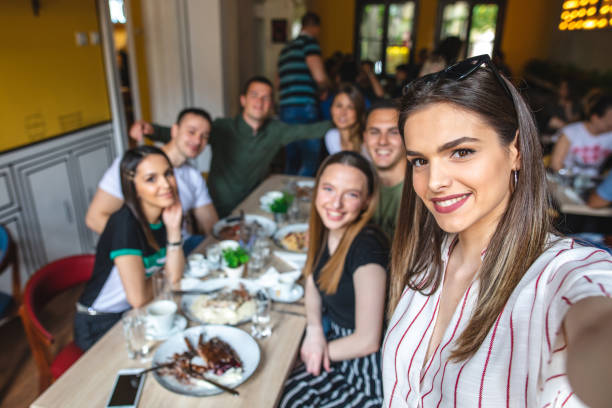 istock Beautiful friends doing a selfie at a cafe restaurant 1152897404