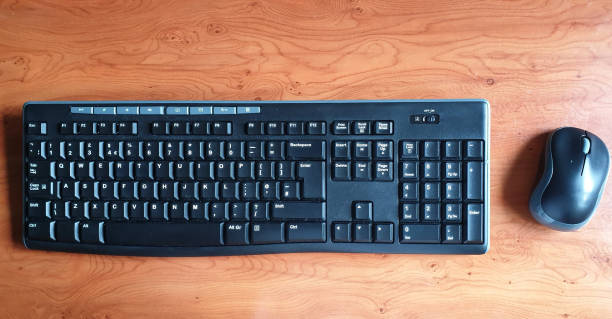 istock Aerial view of wireless keyboard and mouse on desk with copy space 1152899177