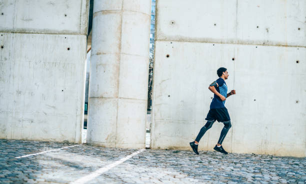 istock Sporty young man running outdoor 1152899184