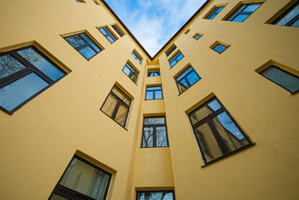 istock Looking up a yellow apartment building. 1152899798
