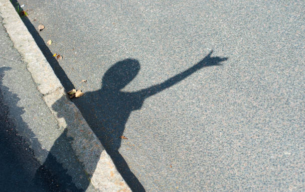 istock A person making a shadow with the hand looking like a dog. 1152904775