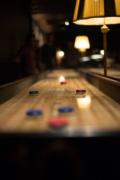 istock Playing the game of shuflleboard. 1152904781