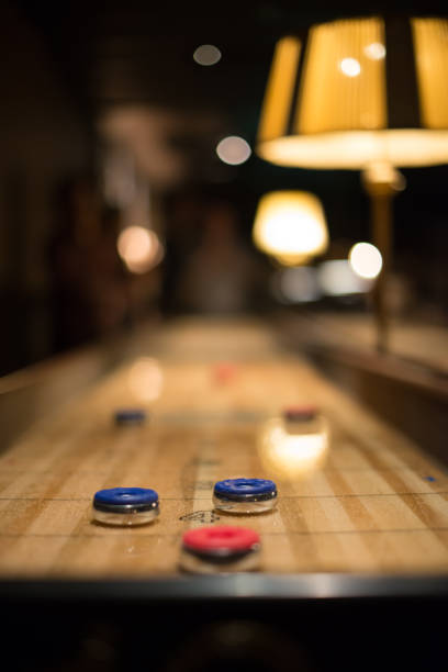 istock Playing the game of shuflleboard. 1152904799